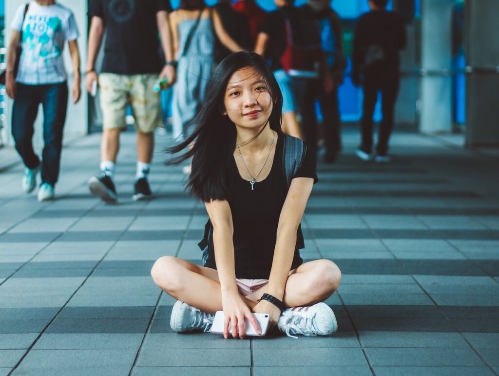 college age girl sitting