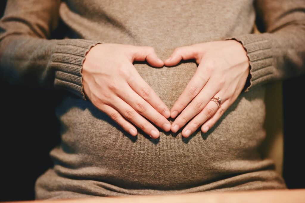 pregnant heart hands min