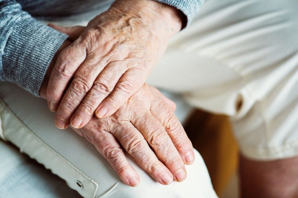 older hands close