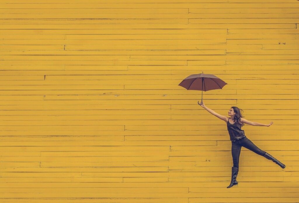 woman with umbrella happy